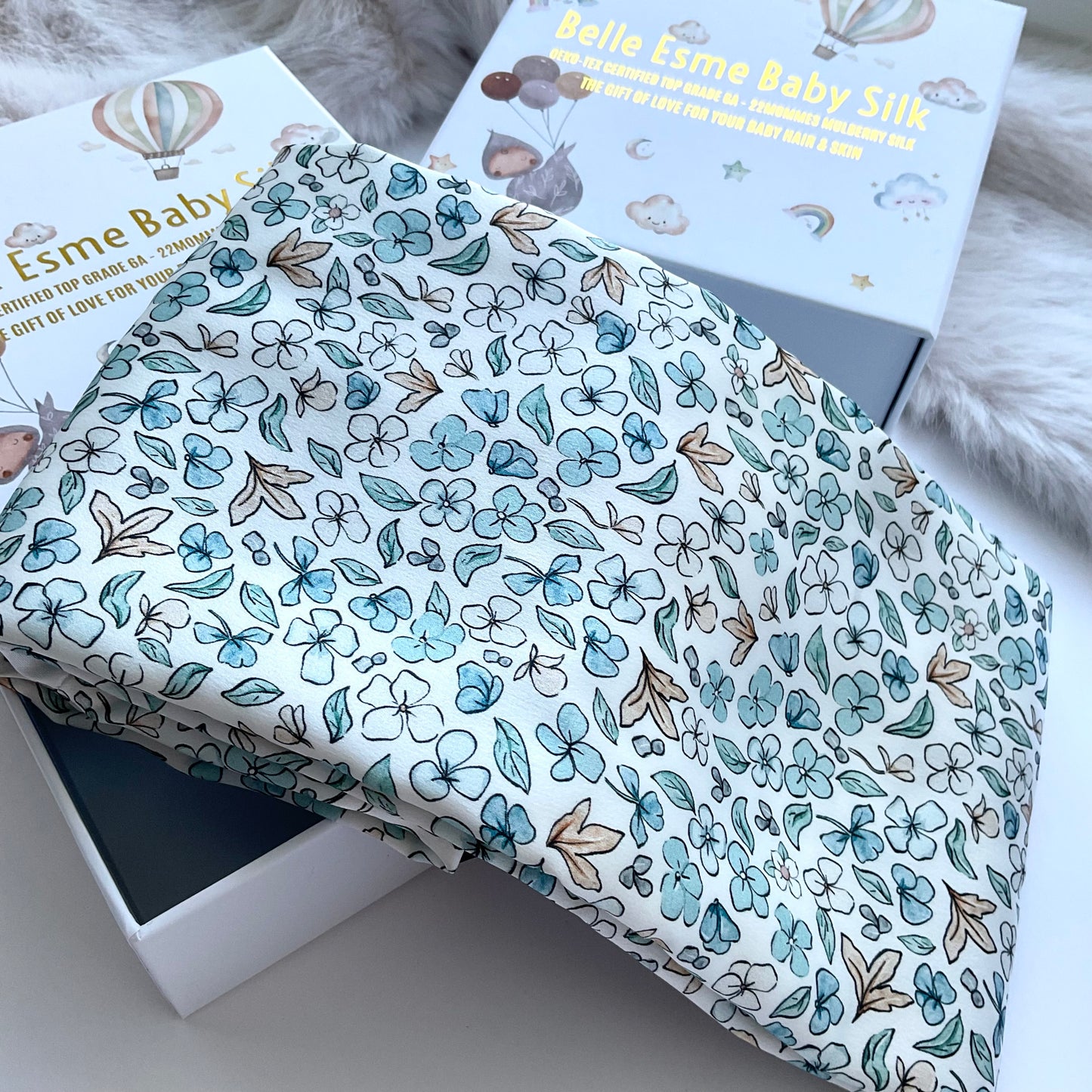 Ditsy Winter Blue Mulberry Silk Baby Cot Sleeve, cot slip (angle shot) for Baby bald spots and Eczema relief