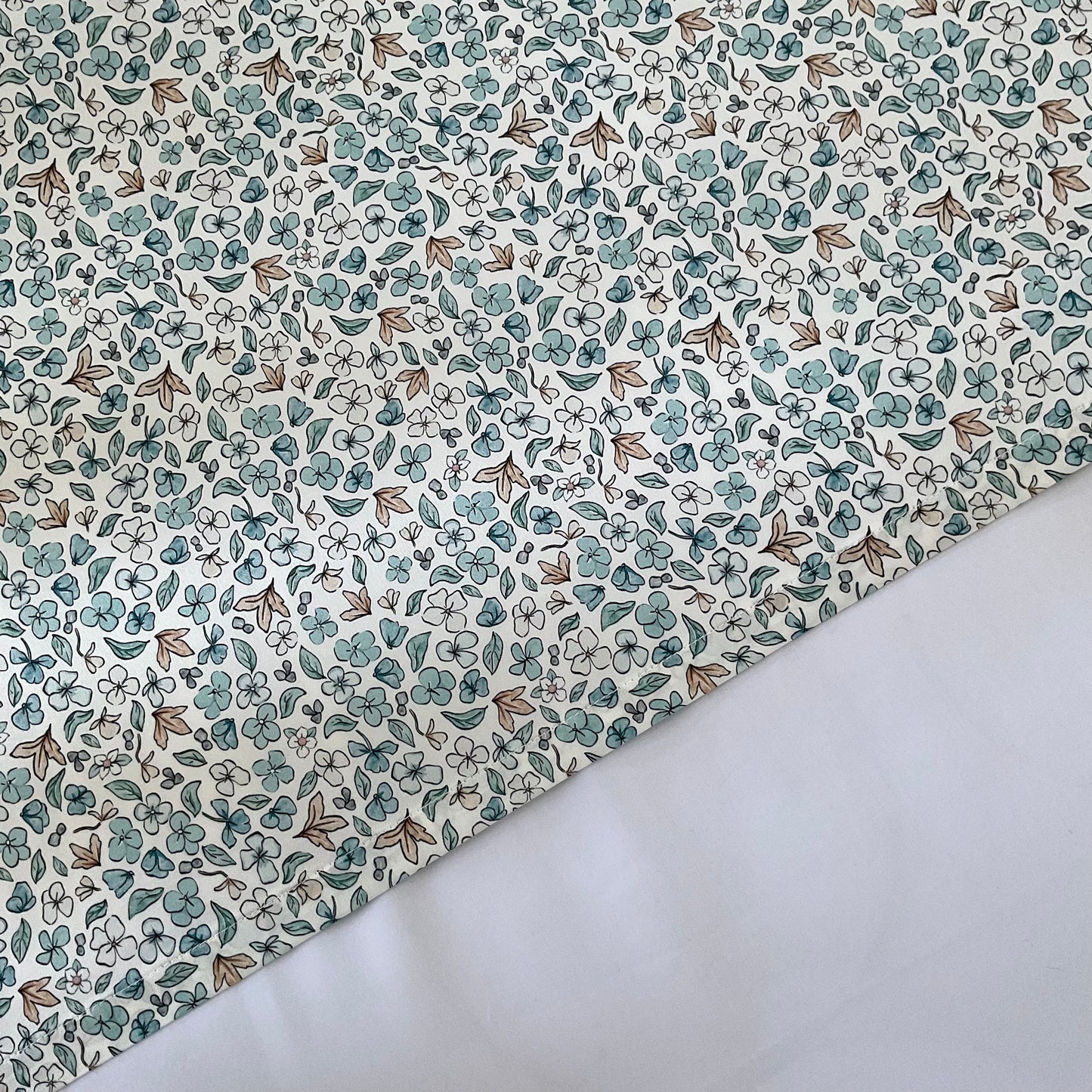 Mulberry Silk Baby Cot/Crib Sleeve - Ditsy Blue Winter. Helps with baby bald spots and eczema relief