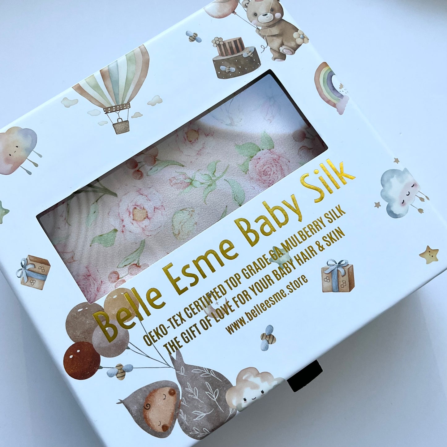 Belle Esme Baby Silk packaging with baby-themed illustrations on a white background