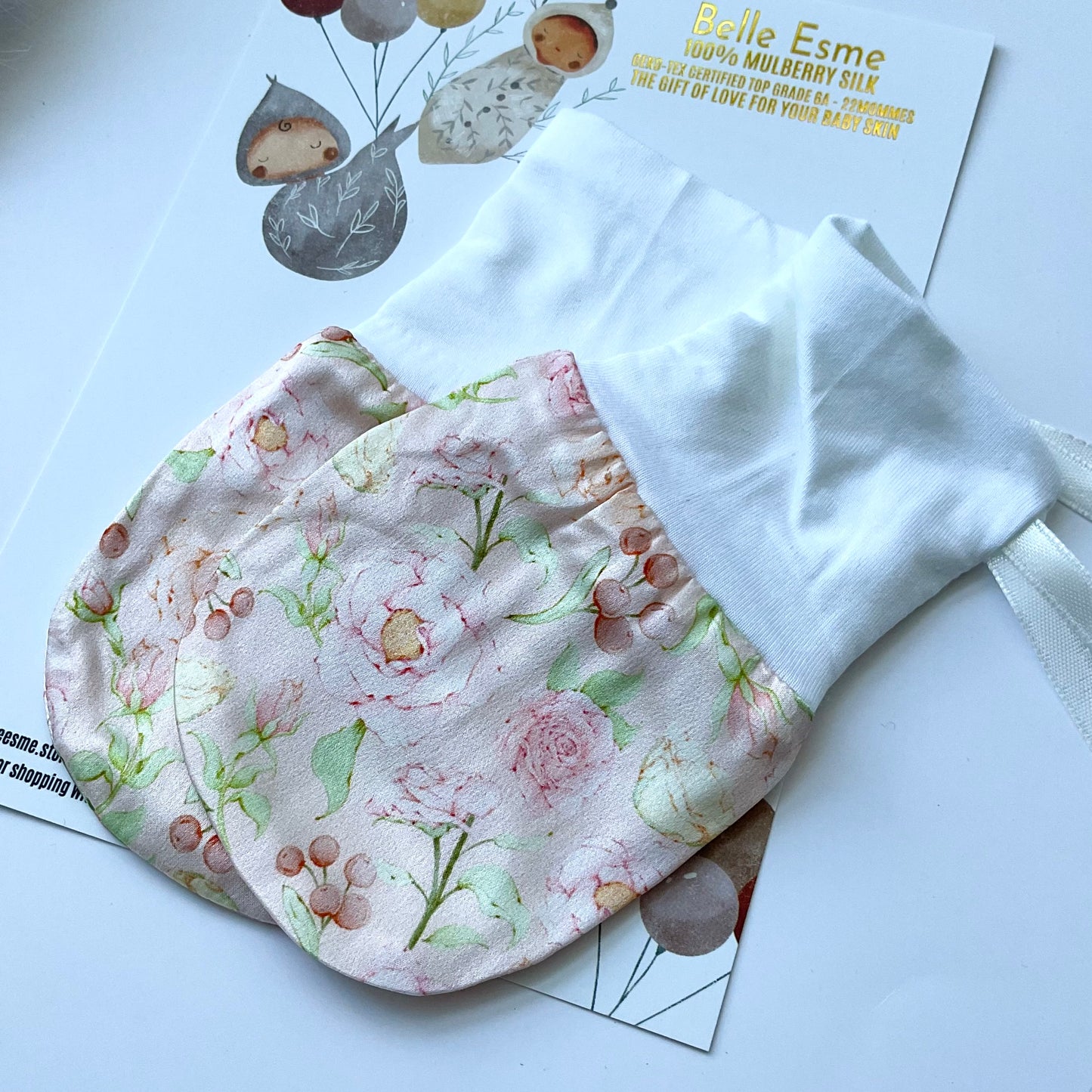 Mulberry silk baby mittens for eczema relief outside packaging with charming rose pattern