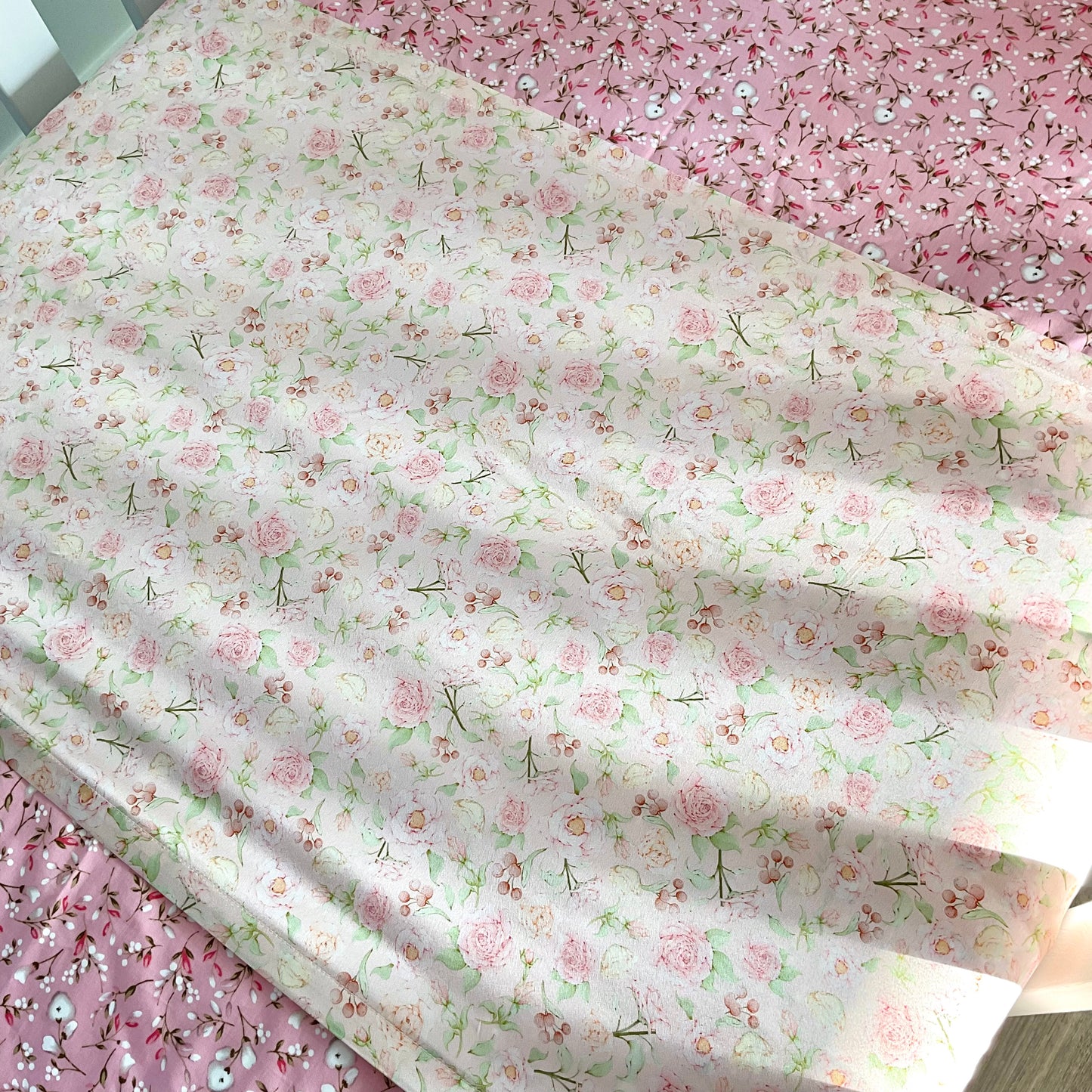 Mulberry silk baby cot slip/sleeve in cute ditsy rose pattern pastel pink colour on mattress