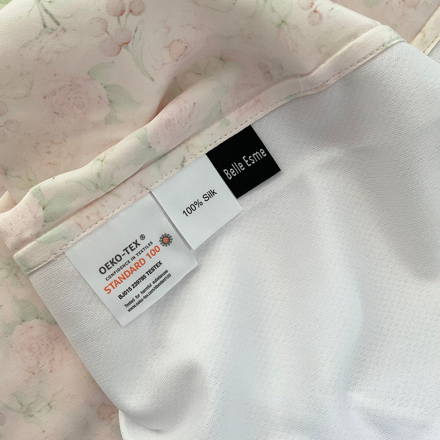 Silk fabric with labels indicating OEKO-TEX and 100% Silk, brand 'Belle Esme'.
