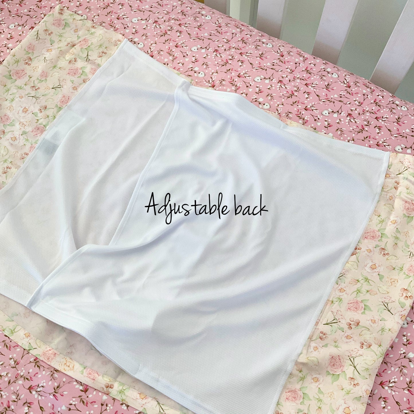 Mulberry silk baby cot slip/sleeve in cute ditsy rose pattern pastel pink colour back shot with Adjustable back