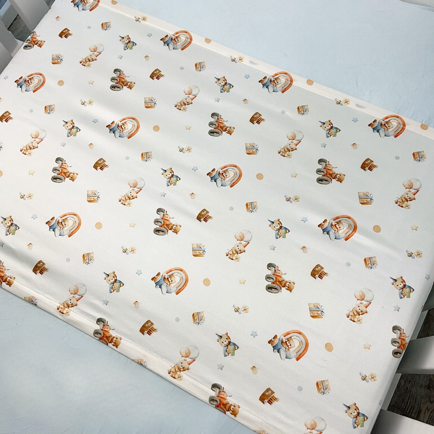 Close up shot of Mulberry silk baby cot slip/sleeve in cute bear and party pattern